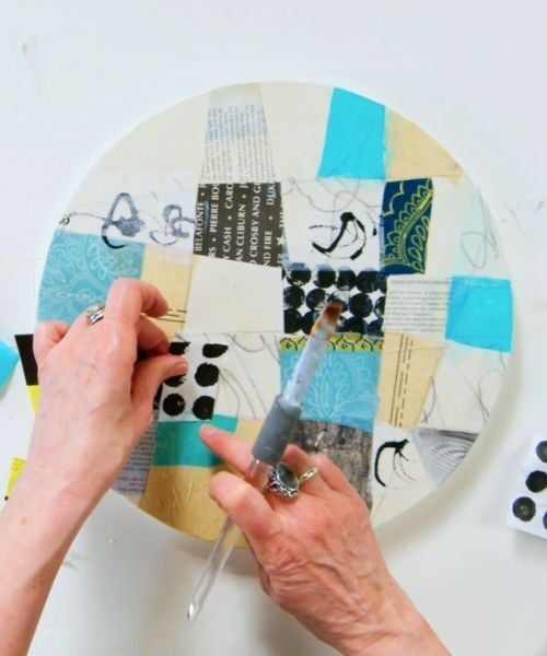 Kagemanns hands working on circle collage