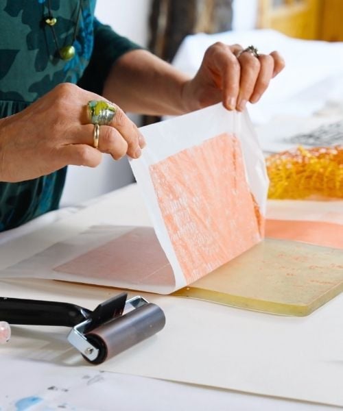 Kagemann pulling orange paper off of gel plate